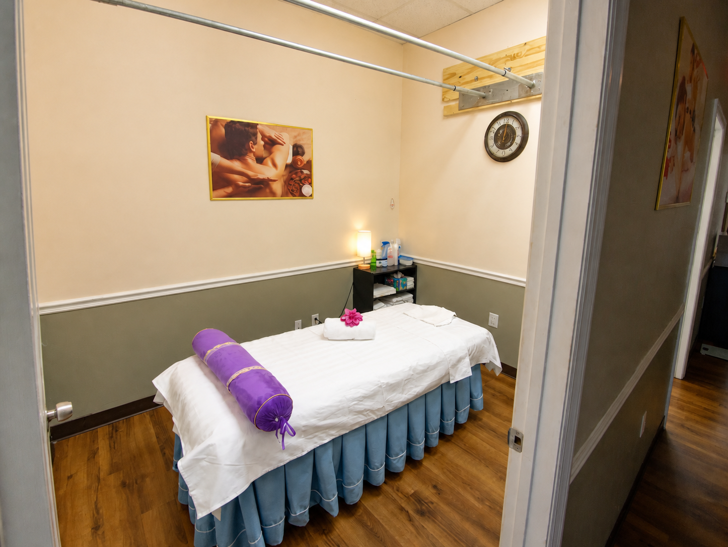 Lotus Spa Ashiatsu room with massage table and overhead support bars